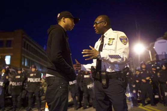 Police enforce curfew in riot-hit Baltimore