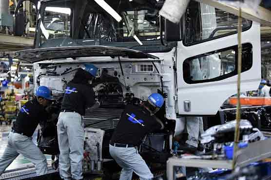 Japan factory output inches down in March