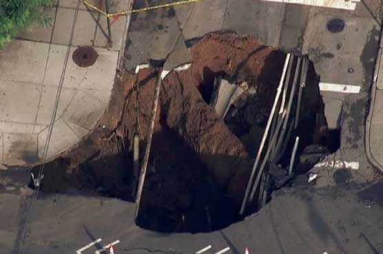 Giant sinkhole swallows up New York street