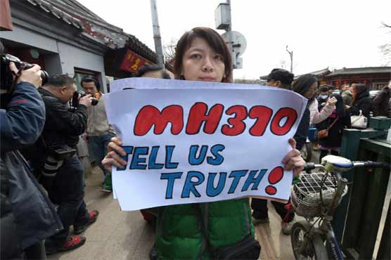 MH370 families reject Malaysia's conclusion on plane debris 