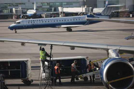 Man charged with trying to halt departing plane at Denver airport