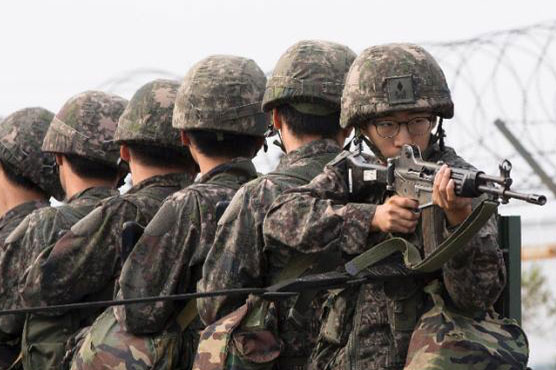 North, South Korea agree to defuse crisis after marathon talks