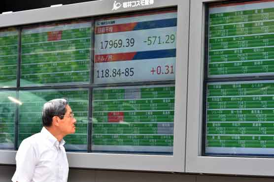 Asian shares fall as panic grips world markets