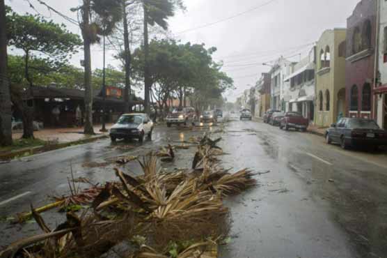 Storm kills 12 in Dominica, menaces Haiti