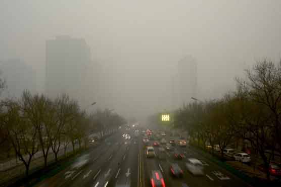 Beijing declares first-ever red alert for pollution