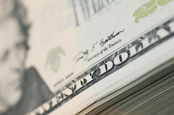 Dollar slips on low oil prices