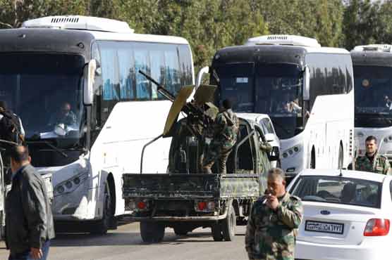 Syria rebels begin leaving Homs under truce deal 