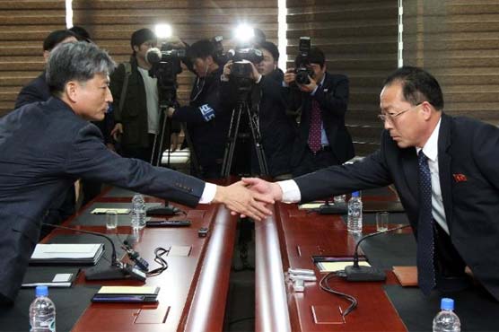 Two Koreas seek to ease tension at high-level talks 