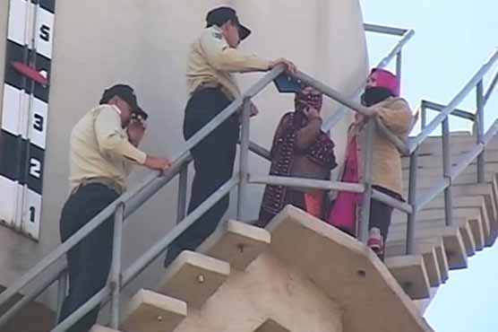 Female nursing candidates protest atop water tank in Faisalabad