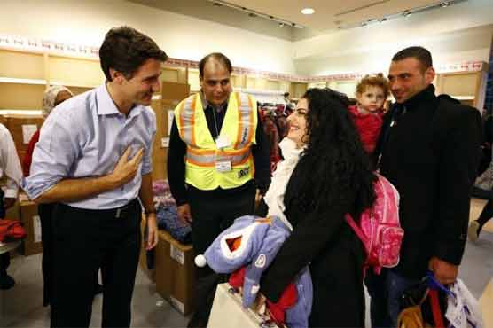 Canadian Prime Minister welcomes first batch of Syrian refugees