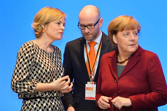Merkel seeks to silence party rebels over refugee stance