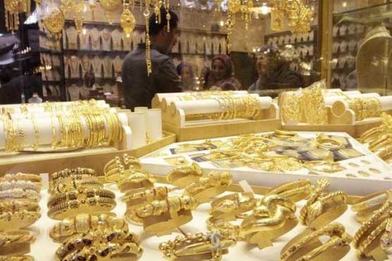 Gold holds losses from biggest dip in 5 months after Fed rate hike