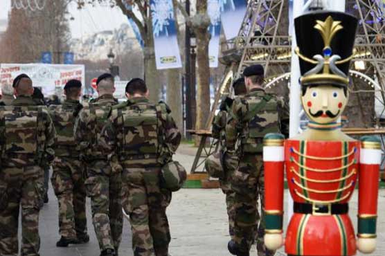 Attacks cast pall over Christmas in Paris and around the world