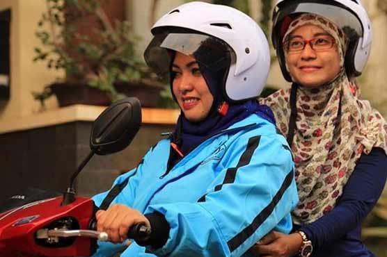 Indonesia's Muslim women hail female-only motorbike taxis