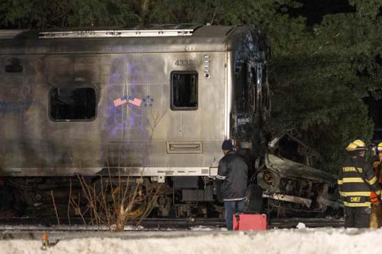 NY commuter train slams into car on tracks, killing 6 people