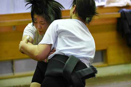 Japan's women wrestlers take on sumo's big boys