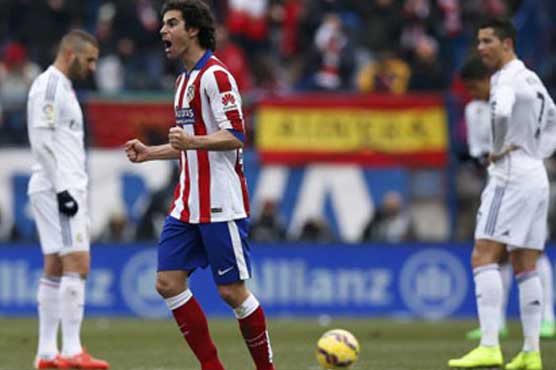 Atletico thrashes Real 4-0 in derby to toss open title race
