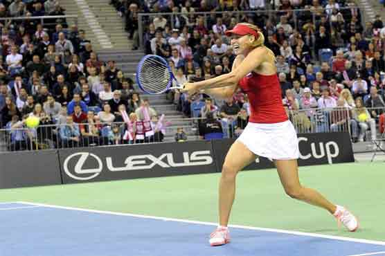 Tennis: Sharapova leads Russia into semis as France stun Italy