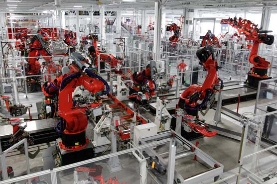 Robots replacing human factory workers at faster pace