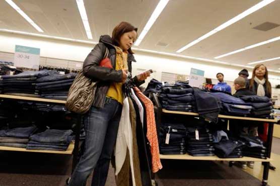 Cheaper gas lowers US retail sales; spending up elsewhere