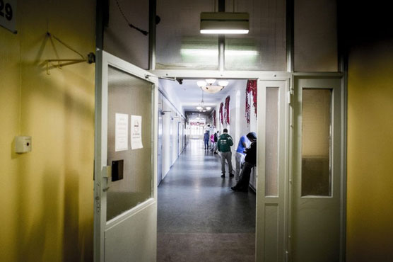 Woman in Sweden denies locking up daughters 'for years'