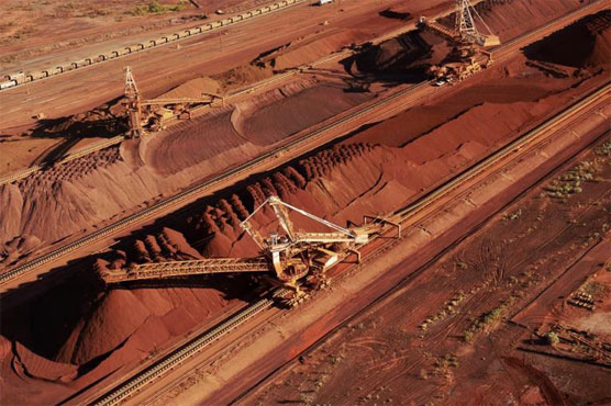 Mining giant BHP Billiton H1 net profit almost halves 