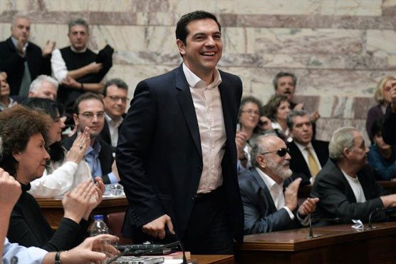 Greece hails 'turn in the tide' but debt problems loom