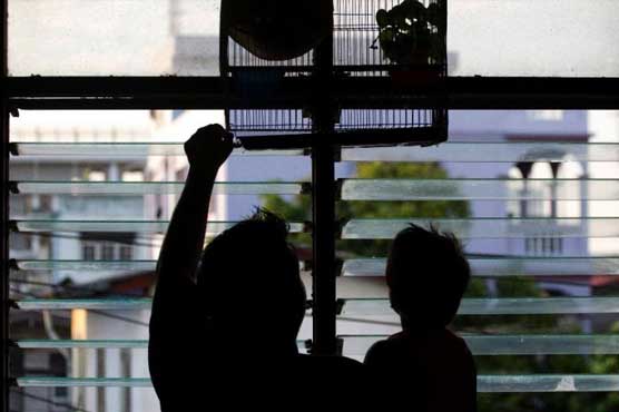 Stuck in limbo, Bangkok's hidden urban refugees scrape by