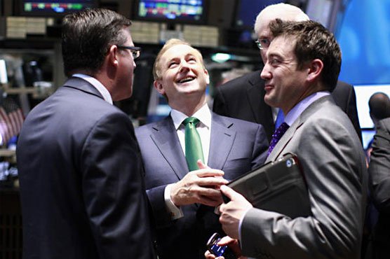 Stocks slip at midday after weaker estimate of US growth