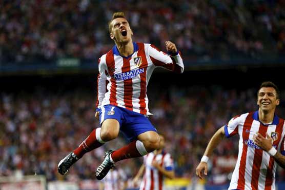 Griezmann double keeps Atletico on Real's shoulder