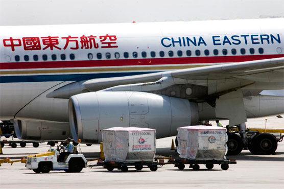 China travelers open emergency exits to protest flight delay