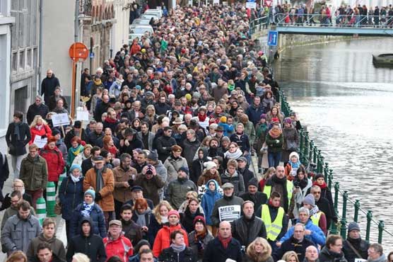 Tens of thousands march across Europe in solidarity with France