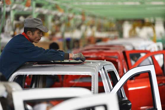China auto sales slow in 2014 but reach 19.7 mln vehicles