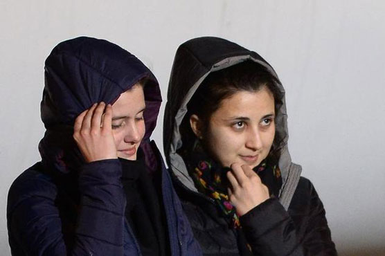 Ransom row erupts as abducted Italian women fly home