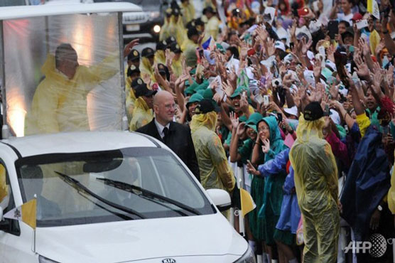 Pope flees Philippine storm, cuts short typhoon mercy trip