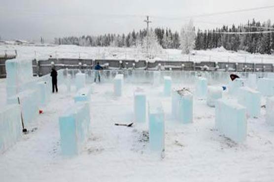 Workers craft ice playground ahead of Alaska sculpture event
