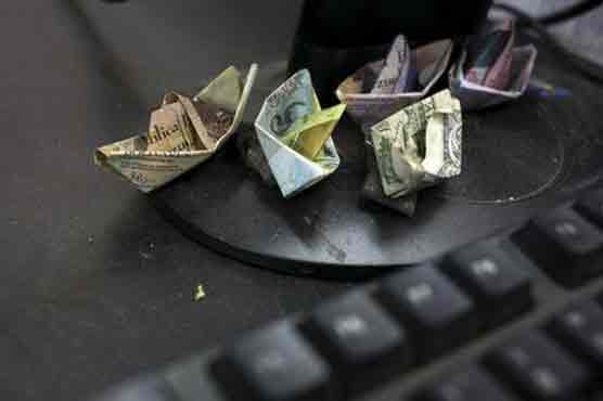Bolivar boats, bills in bras as Venezuela's currency sinks