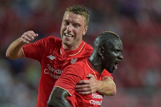 Football: Heavens open as Liverpool thump Thai All Stars