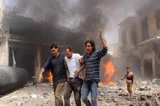 Barrel bombs kill 11 civilians in IS town in Syria