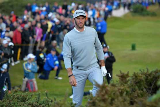 Golf: Johnson in halfway lead at weather-hit Open