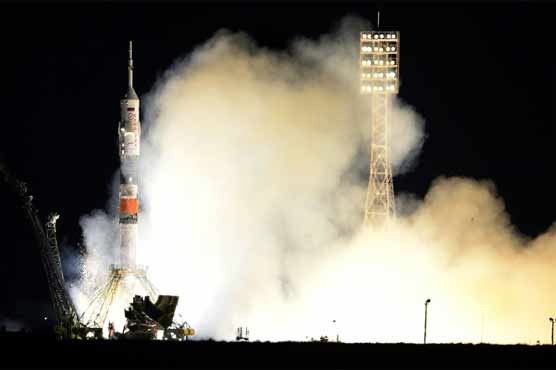 Rocket carrying Russian, Japanese, US crew docks with ISS 