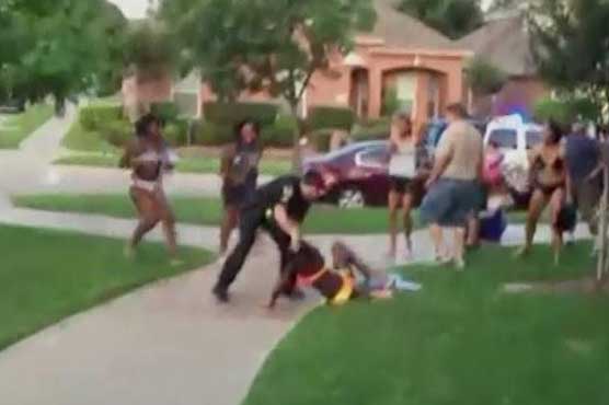 Video of officer who drew gun on black teens raises tension