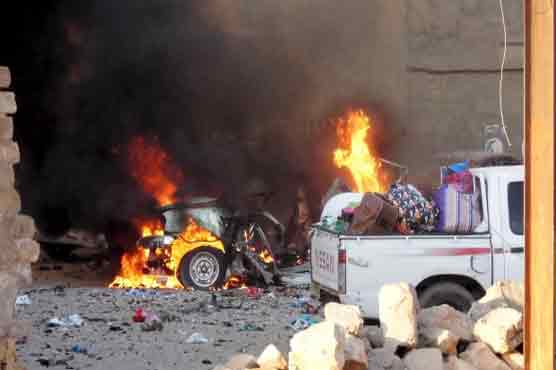 2 suicide car bombings targeting police kill 18 in Iraq