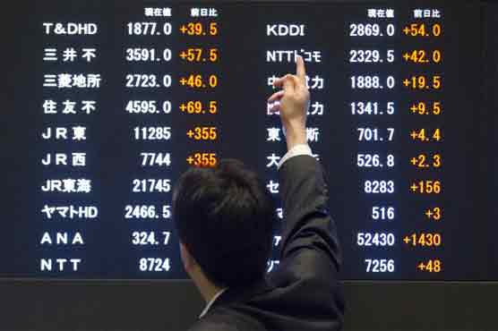 Asia stocks up, dollar sags as Fed tempers expectations for rate rise