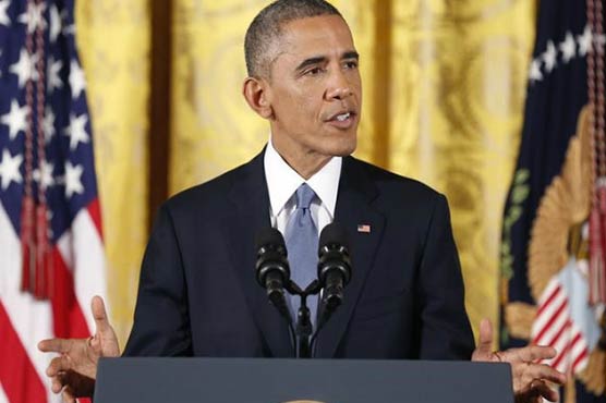 Strident Obama says gun control laws will change