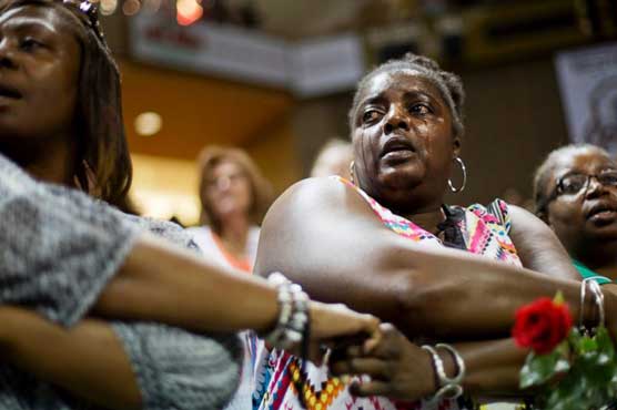 'We Shall Overcome' rings out at Charleston vigil