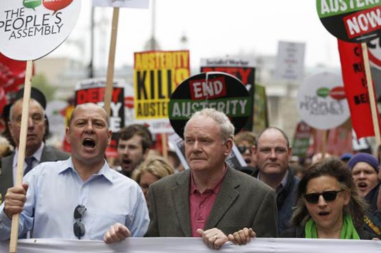 Protesters throng London to oppose new UK government's austerity plan