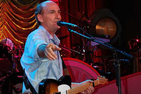 After five decades, James Taylor hits number one in US