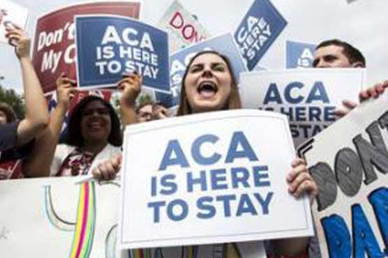 U.S. top court backs Obamacare, president says it's here to stay