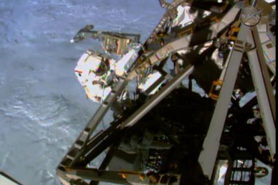US astronauts speed through spacewalk at orbiting lab